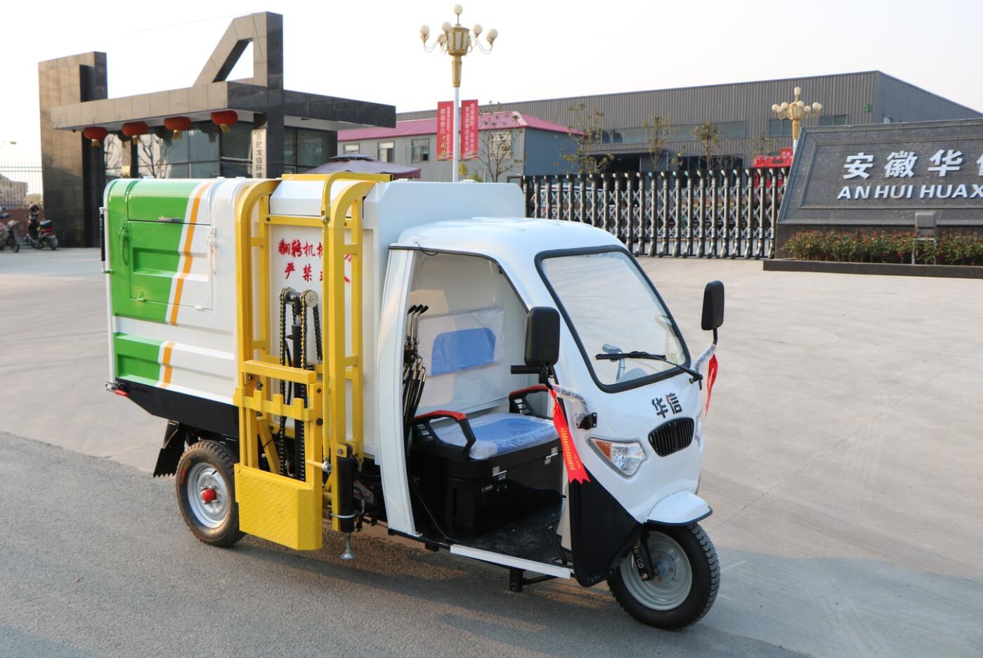 Side tipper electric powered garbage collection and dumping tricycle