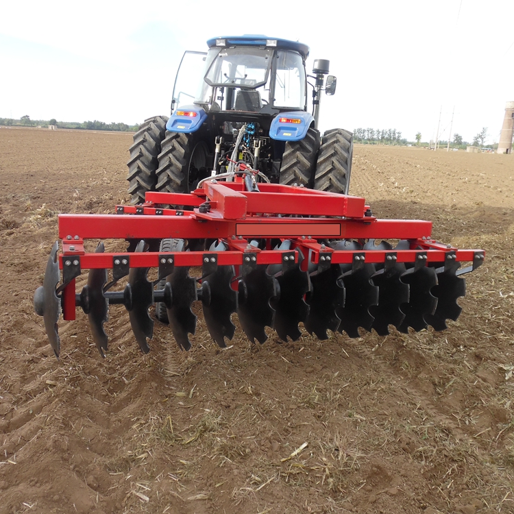 disc plough is mounted with tractor