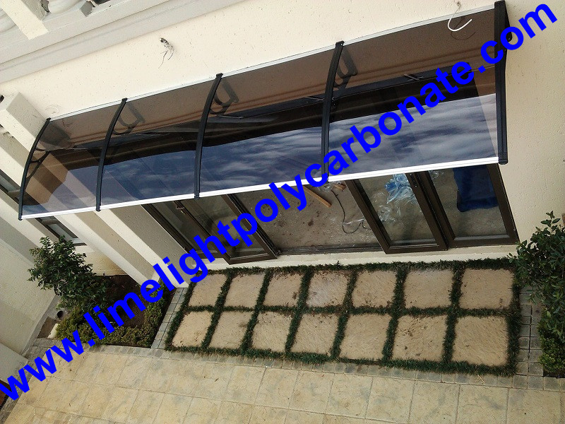 door entrance awning canopy with black bracket and bronze polycarbonate solid sheet