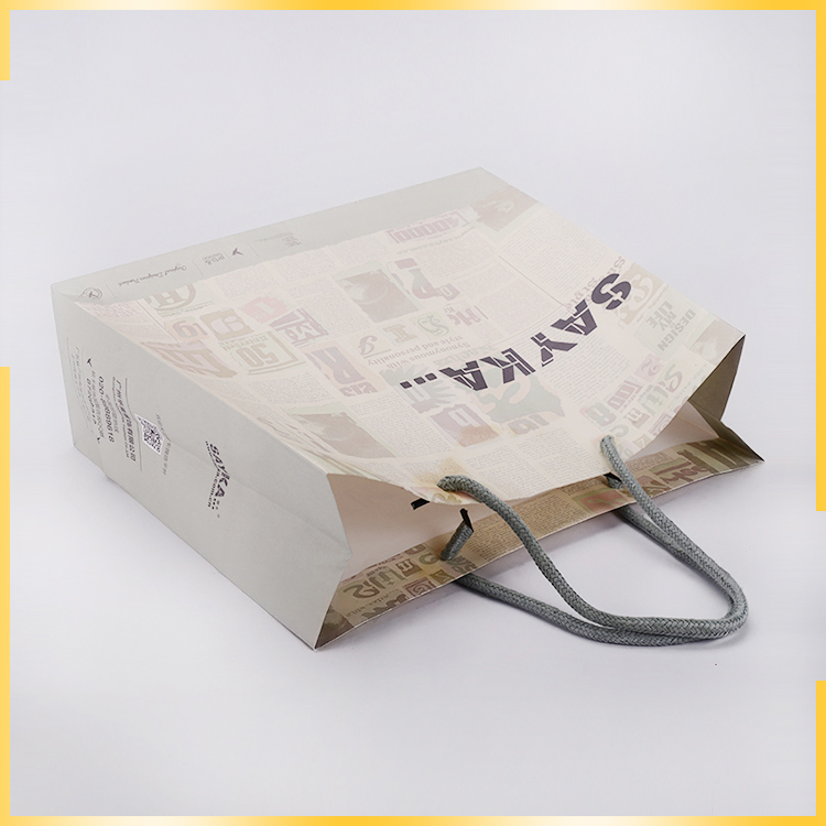 Recyclable newspaper style shopping packaging customized craft paper bag for wholesale