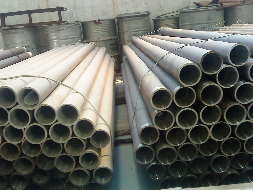 Titanium alloy lined pipe