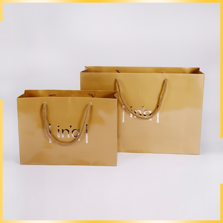 Promotional elegant apperance sole printing three stranded rope fancy paper gift bag for wholesale