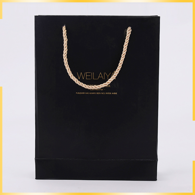 Promotional elegant apperance sole printing three stranded rope fancy paper gift bag for wholesale
