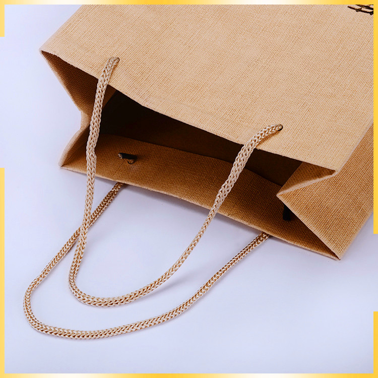 Attractive design enviornmental cloth imitated and part of UV customised paper bag with logo for packaing