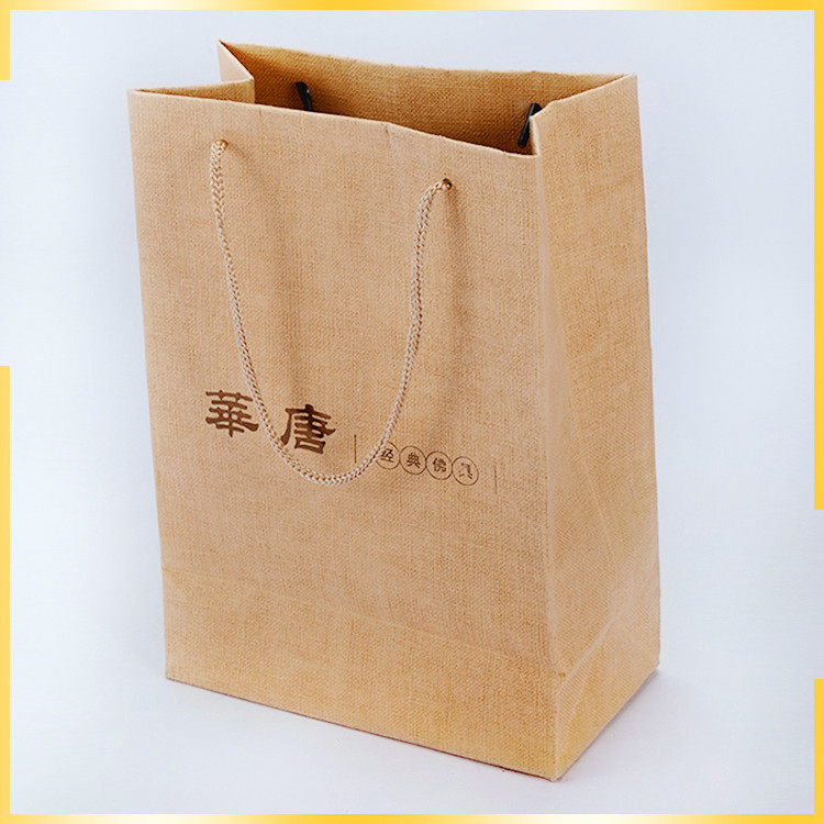 Attractive design enviornmental cloth imitated and part of UV customised paper bag with logo for packaing