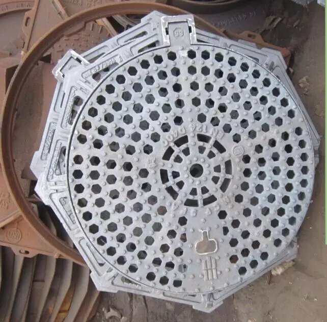 Cast iron squareroundoctagonal frame as supporting base and a round grate