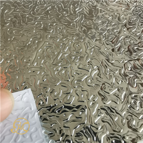 Embossed metallic PETPVC laminated film for heat insulation roof panels