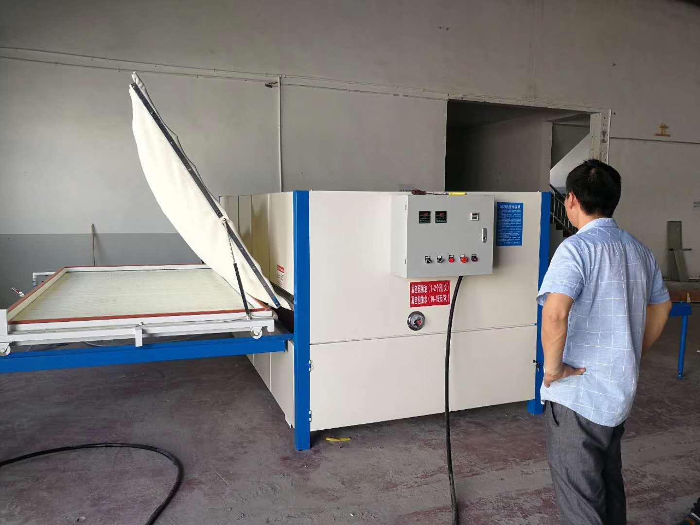 Wood grain transfer machine for doors