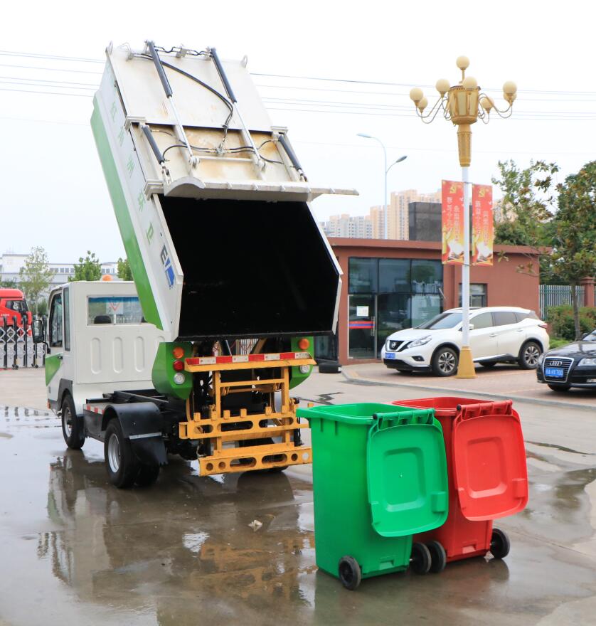 Rear tipper and dumping garbage compactor truck