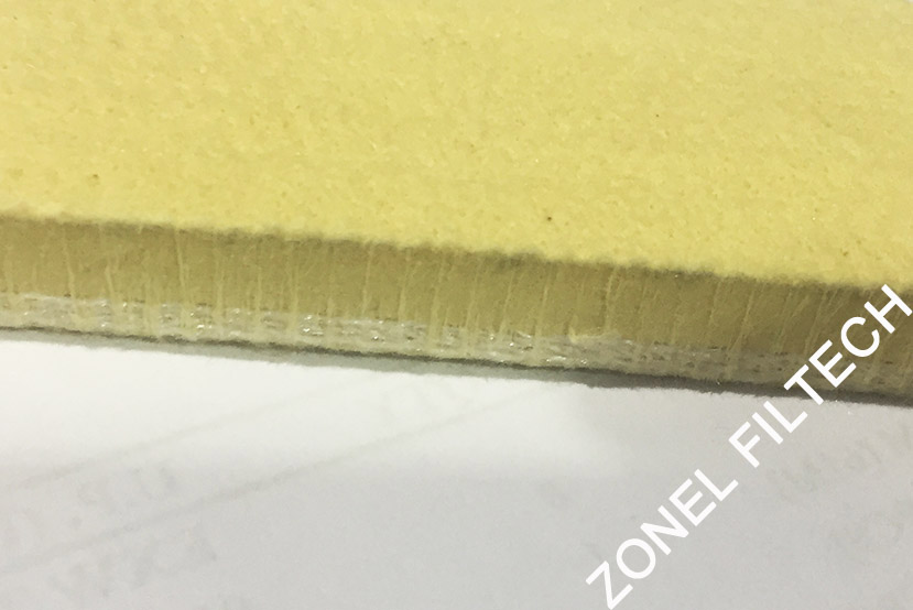 Aramid air slide fabrics for high temperature particles transfer