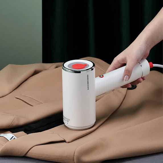A garment steamer is a machine that uses hot water vapor to continuously
