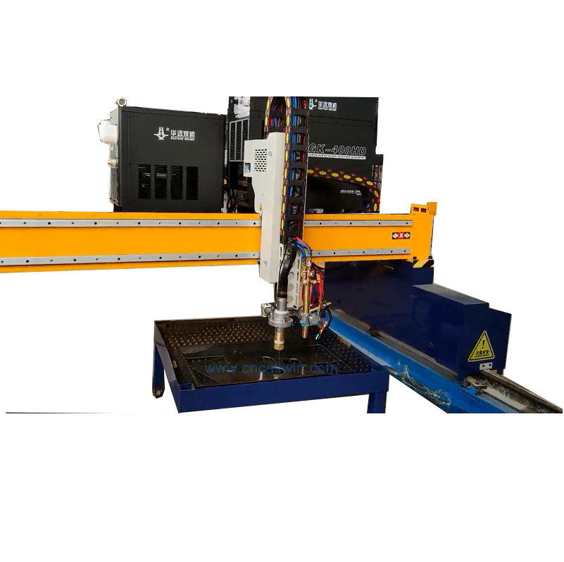 CNC Gantry plasma cutter with water spray torch cutting metal steel